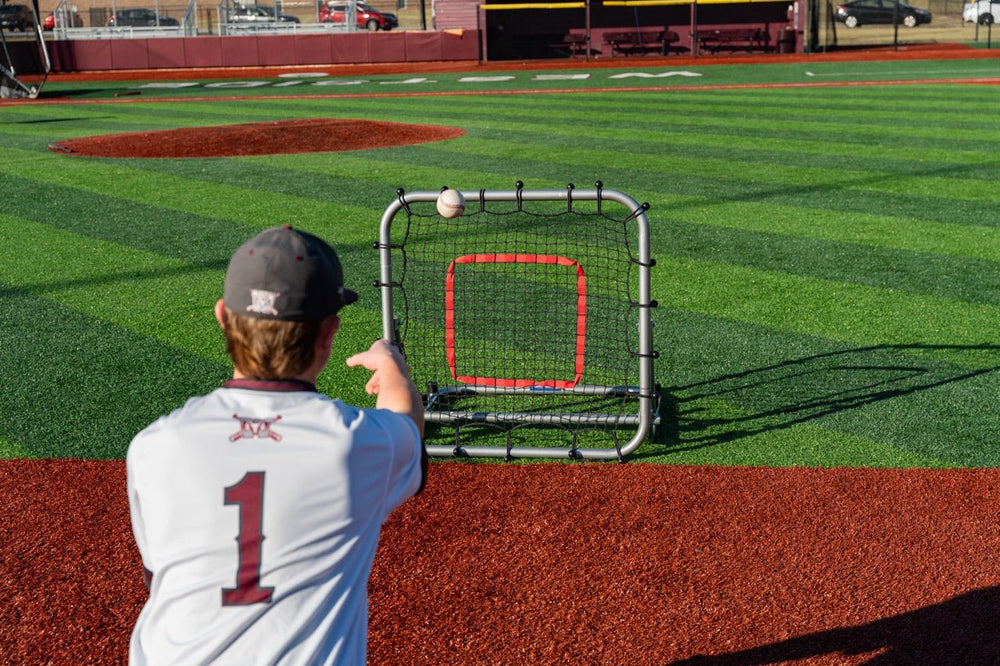 Baseball player training with a Pro Rebounder